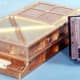 The DSKEY input module (right) shown alongside the Apollo Guidance Computer's main casing (left).