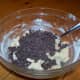 Now for the good part - Pour in the enitre 12 oz. bag of Nestle semi-sweet chocolate chips into the dough.
