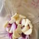 In a blender, combine the sliced garlic with shallots and onion.