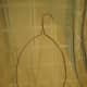 Bend hanger into desired shape. Wide shapes will be harder to pull stockings over unless you have a large sized stocking.