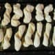 Repeat with each piece. Cover the pan with a towel and let the dough rise in a warm place for about an hour.