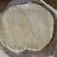 Roll dough out into a circular or rectangular shape, about a 1/4 inch to 1/2 inch thick.