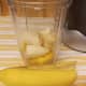 Chunk the banana into pieces and place them in the blender.