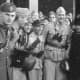 Skorzeny (center, binoculars hanging from neck) with the liberated Mussolini September 12, 1943.