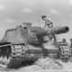 An abandoned SU-152 assault gun inspected by German troops, Soviet Union, 1943. Only 670 would be built in the war.