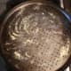 Sprinkle yellow cornmeal on pizza pan.