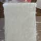Working in small sections, apply a thin layer of Modge Podge and sprinkle your fake snow on top. Work your way around the entire bucket.