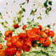 Combine the diced tomatoes in the avocado and stir until it's well combined.