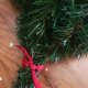 Knot your ribbon at the bottom of your tree.
