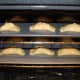 Place the cookie sheets into a preheated oven. Bake at 350 degrees F or until the empanadas are golden brown.