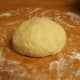 Transfer the dough to a lightly floured flat surface. Knead the dough until it is soft and pliable.