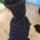 Twist the excess at the top and tie your string around it.