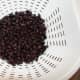 Drain and rinse the can of black beans and add them to the salad.