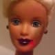 Darker lipstick with red in the corner of Barbie's mouth signifies a freshly eaten meal. Light blue smudges create bruises easily.  Green smudges catch the light.