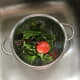 Mixed salad leaves and tomato ready for washing