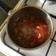 Tomatoes and garlic are added to softened onions