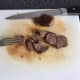 Rested pigeon fillets are thinly sliced.