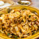 Stir-fried Chinese noodles with vegetables, served as breakfast.