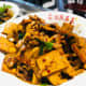 Stir-fried tofu with chilies and vegetables.
