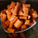 Peel and slice carrots.