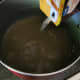 Pour chicken stock into the same pan used to cook chicken.