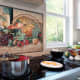 A mosaic in a kitchen can help bring some atmosphere to the room. Consider adding art of food or wine.
