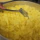 Fluffy scrambled eggs are prepared from scratch with cheese.
