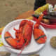 Whole lobsters were served with steak, corn on the cob and a variety of other delectable dishes. 