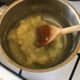 Apple sauce is regularly stirred as it breaks down