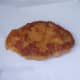 Pheasant shnitzel is drained on kitchen paper