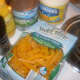 The package of penne pasta, 3 cans of tuna fish, mayo, mustard and black pepper are pictured here.