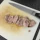 Rested pheasant breast is sliced