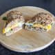 Halved smoked salmon and fried duck egg ciabatta