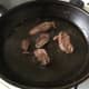 Goose is turned to fry on second side