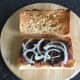 Thin onion strips top wild goose strips and pate