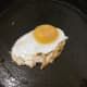 Duck egg is put on to fry in goose juices