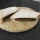 Goose and curry sauce sandwich is sliced to serve