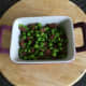 Pea and pigeon pie filling is added to dish