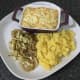 Sauteed cabbage and onion and mashed Swede are plated with hunter's pie