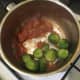 Cooled sprouts are added to chilli sauce