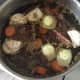 Water is poured in to stock pot and brought to a moderate simmer