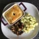 Mash and garlic mushrooms are plated alongside pea and pigeon pie