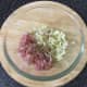 Chopped bacon and cabbage is seasoned