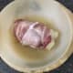Cooked chicken breast with cabbage in bacon