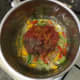 Tomatoes and seasonings are added to sauteed vegetables