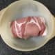 Bacon wrapped chicken breast in casserole dish