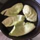 Cabbage leaves are fried in bacon fat