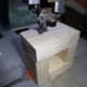 Cutting the wooden tube into small square.
