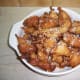 14. Greek style doughnuts (loukoumades) drizzled with warm honey and sprinkled with cinnamon and sesame seeds.