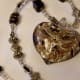 Necklace with heart pendant on stretch string.